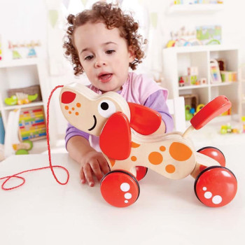 Hape Walk-A-Long Puppy Wooden Pull Toy by Hape | Award Winning Push Pull Toy Puppy For Toddlers Can Sit, Stand and Roll. Rubber Rimmed Wheels for Easy Push and Pull Action, Red