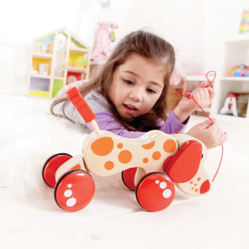 Hape Walk-A-Long Puppy Wooden Pull Toy by Hape | Award Winning Push Pull Toy Puppy For Toddlers Can Sit, Stand and Roll. Rubber Rimmed Wheels for Easy Push and Pull Action, Red